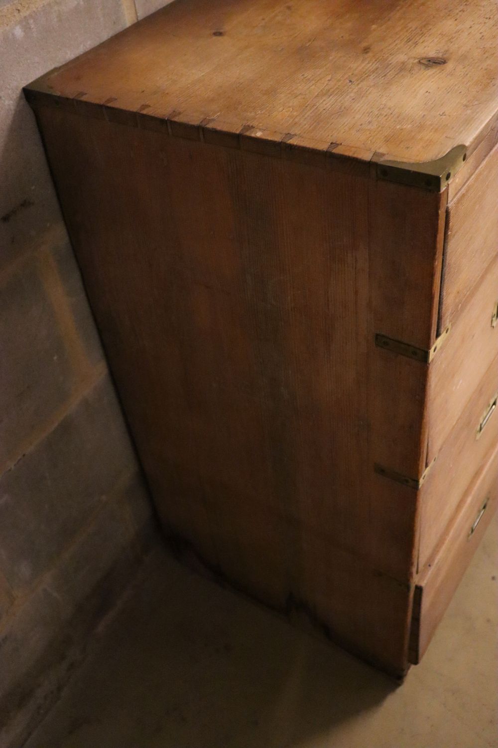 A Victorian pine chest of drawers having later brass mounts, width 90cm depth 44cm height 88cm